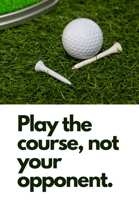 A Golf Ball And Two Tees Sitting On The Grass