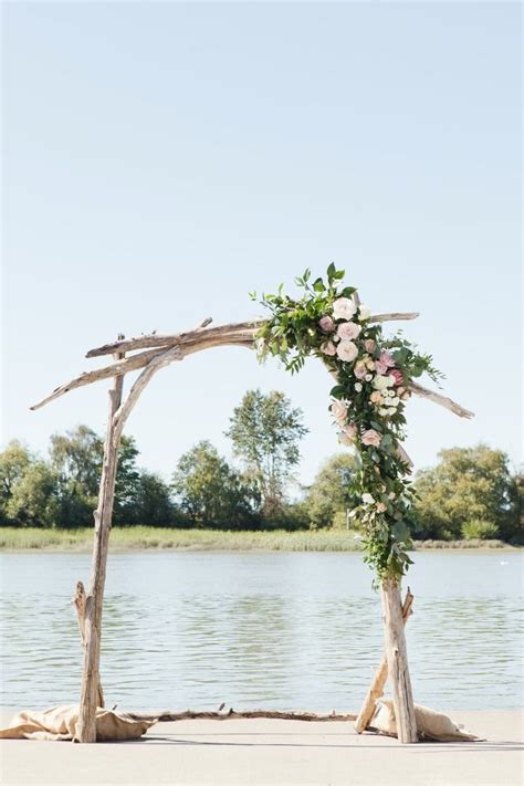 Driftwood Wedding Arch With Asymmetrical Flower Accent Wedding Arbors