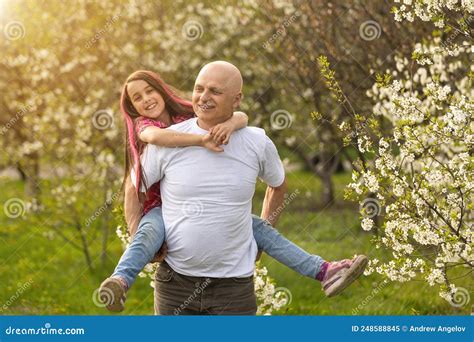 Grandfather And Granddaughter In Backyard Stock Image Image Of