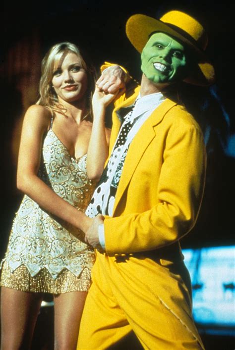 Jim carrey, cameron diaz, peter riegert, peter greene, amy yasbeck directed by chuck russell. "The Mask" movie still, 1994. L to R: Cameron Diaz, Jim ...