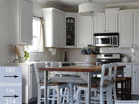 Then you can place it back down on the sawhorse and roll the last side that's facing you. Adding wood trim to kitchen cabinets | Diy kitchen ...