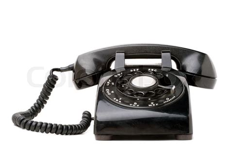 An Old Black Vintage Rotary Style Telephone Isolated Over A White