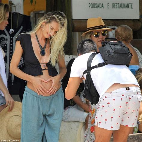Pregnant Candice Swanepoel Cradles Bump On The Beach Daily Mail Online