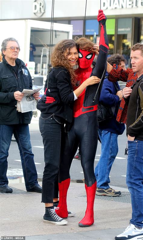 Far from home' costume while filming with zendaya in nyc | tom holland dons spider man far from home costume. Tom Holland swings into action with Zendaya in his arms on ...