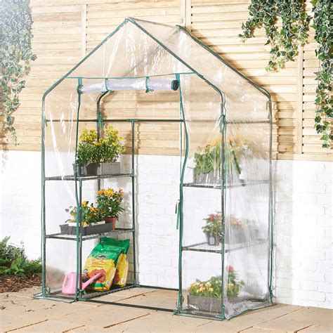 A greenhouse is designed to attract and trap heat. VonHaus Walk In PVC Plastic Greenhouse with 6 Shelves ...