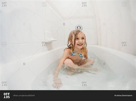 Babe Girl Taking A Bath With Goggles Around Her Neck Stock Photo OFFSET