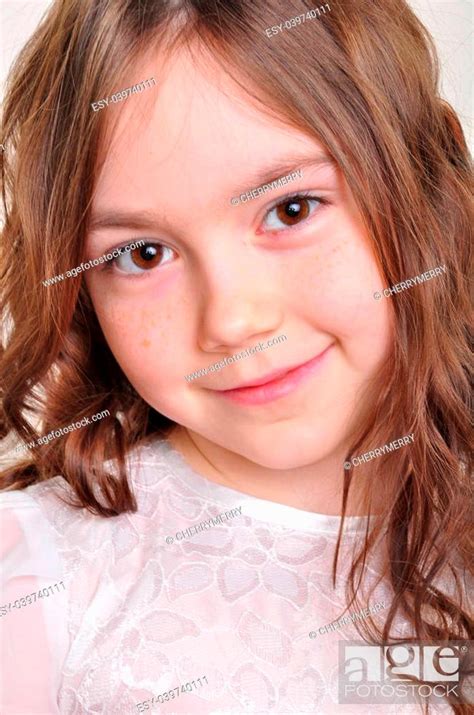 Portrait Of A Pretty 8 Year Old Girl In White Dress Stock Photo