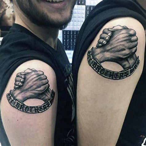 Identical Brothers Tattoo Of Hands Holding On Upper Arm For Guys Bro