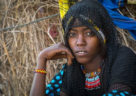 Portrait Of An Afar Tribe Woman With A Black Veil And A Beaded Necklace