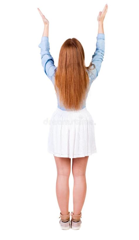 Back View Of Beautiful Woman In Dress Looking At Wall And Holds Stock