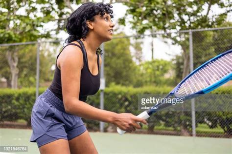 Black Tennis Player Serving Photos And Premium High Res Pictures