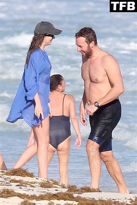 Dakota Johnson And Chris Martin Display Their Beach Ready Bodies While
