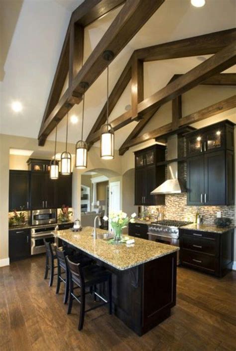 Poorly lit, vaulted ceilings can easily create an oppressive shadow above you, instilling an eerie and uninviting atmosphere. spacious kitchen idea | Vaulted ceiling lighting, Vaulted ...