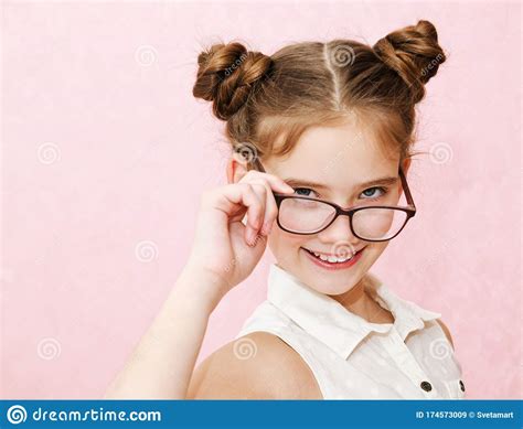 Portrait Of Funny Smiling Little Girl Child Wearing