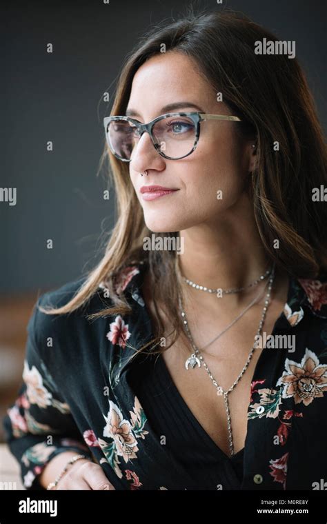 Portrait Of Fashionable Woman Wearing Glasses And Nose Piercing Stock