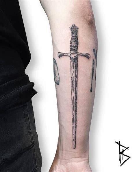 Woodcut Style Sword Tattoo On The Back Of The Right Forearm Sword