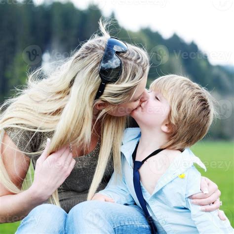 Mother Son Outdoors Kissing 1366821 Stock Photo At Vecteezy
