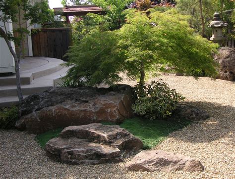 Not only does it raise the property value, it gives off a more inviting vibe that you and your loved ones can enjoy. perfect boulder placement | Landscaping with boulders ...