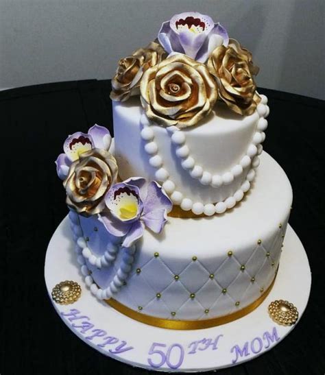 Deliciously beautiful birthday cakes when it comes to decorating the beautiful birthday cakes, you can go for the cream frosting. 50th Birthday Cake for Woman with Gold Roses & Pearl ...