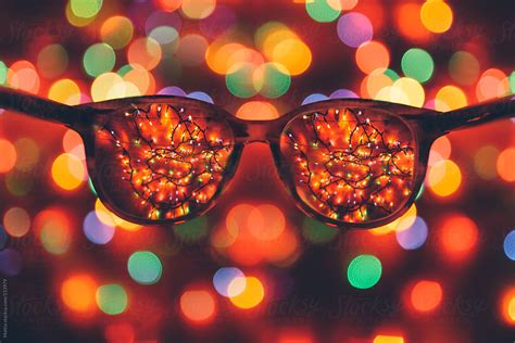 Looking Through Glasses Christmas Lights By Stocksy Contributor