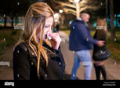 Young Woman Crying in the Night . Betrayal and Infidelity concept