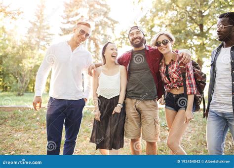 Group Portrait Of Multiethnic Friends Having Fun Together Outdoors