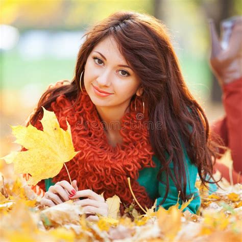 Young Pretty Woman Relaxing In The Autumn Park Beauty Nature Scene