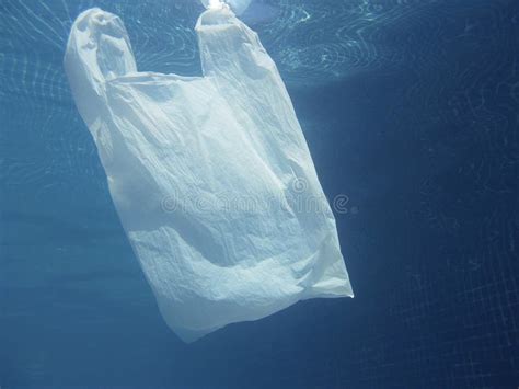 Plastic Bag Floating Into The Water Polluted Enviromental Recycle