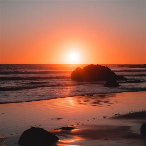 Download Wallpaper 3415x3415 Sea Coast Sunset Stones Waves Horizon