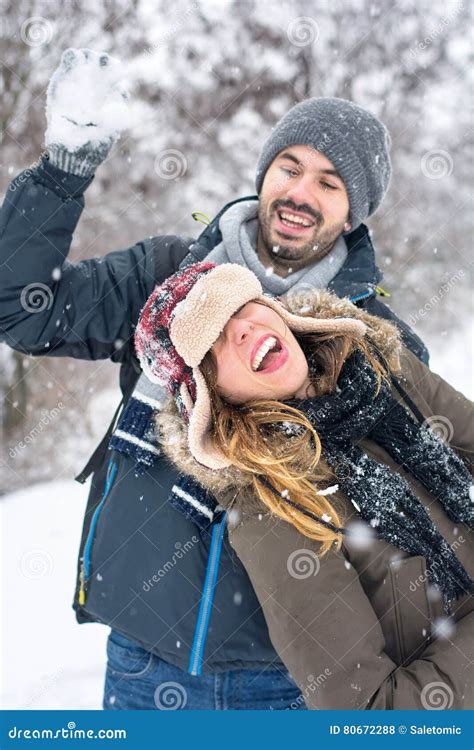 Couple Having Fun In Snow Covered Park Stock Photo Image Of Active