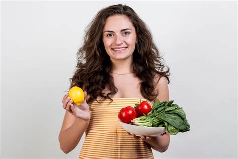 Free Photo Woman Holding Vegetables And Fruits