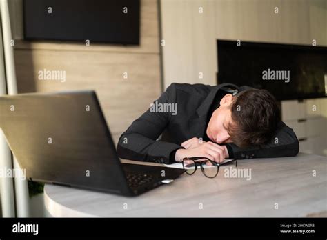 Sleep Worker At The Workplace Tired Employee Lying On The Table