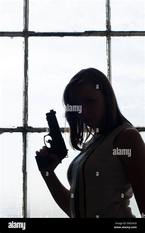 Woman Gun Silhouette Hi Res Stock Photography And Images Alamy