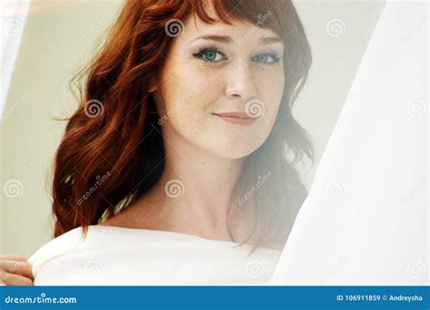 Portrait Of A Beautiful Redheaded Woman Looking Flirtatious Stock