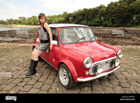 Young Girl Model Pictured With A Mini Cooper On The Pier Overlooking