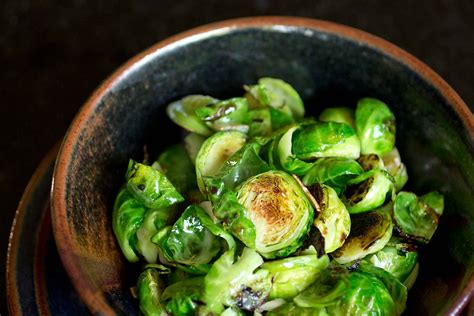 Start with this cheesy brussels sprout casserole—even sprout haters won't be able to resist. Pan Fried Brussel Sprouts with crispy garlic and New Year's Resolutions — Recipe Fiction