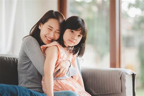 Happy Asian Mother And Cute Little Daughter Having Fun Stock Image Image Of Kiss Love 227365751