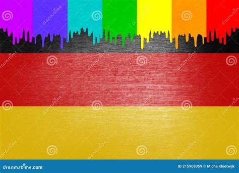 Paint Rainbow Flag Is Dripping Over The National Flag Of Germany Stock