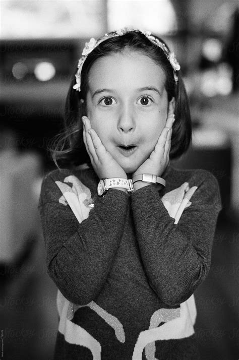 Black And White Image Of A Young Girl Acting Surprised By Stocksy Contributor Jakob