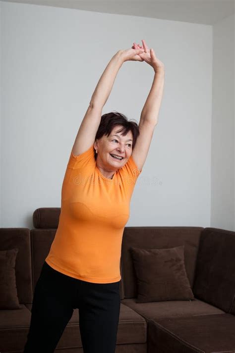 Senior Fitness Woman Exercising At Home Stock Photo Image Of Senior