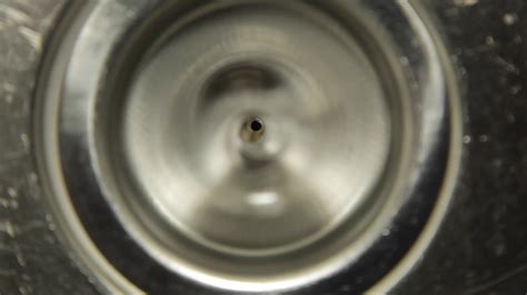 On either side of the sink, if you put water it will fill up the eventually it will drain. Kitchen Sink Drain Draining - YouTube