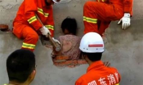 watch firefighters rescue woman stuck between walls for seven hours weird news uk