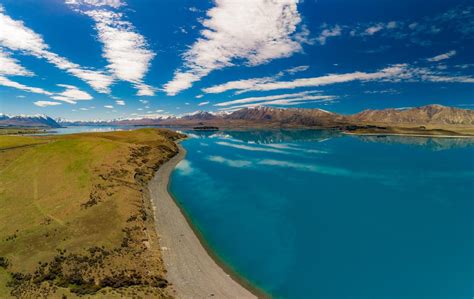 Premium Photo Aerial Drone Shots Of Lake Tekapo With Reflection Of