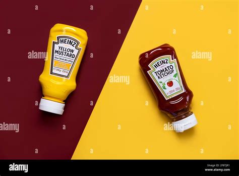 Heinz Ketchup Bottle And Bottle Of Heinz Yellow Mustard On A Red And