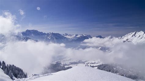 Painting A Sky With Wispy Cirrus Clouds And Snow Capped