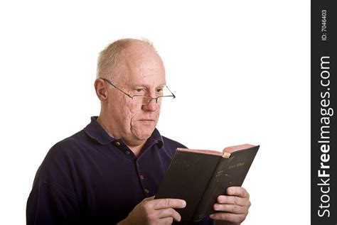 Older Man Intently Reading Bible Free Stock Images And Photos 7046403