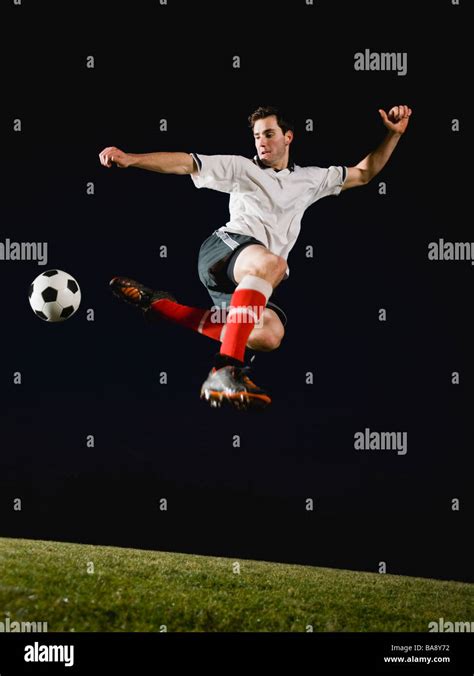 Soccer Player Kicking Ball Stock Photo Alamy
