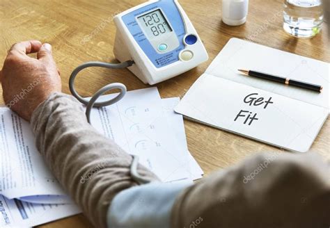 Man Checking Blood Pressure — Stock Photo © Rawpixel 129719704