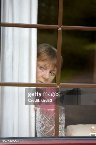 Nosey Neighbour At The Window High Res Stock Photo Getty Images