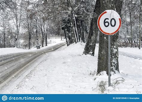 60 Kmh Speed Limit Road Sign In Snowy Road Stock Photo Image Of